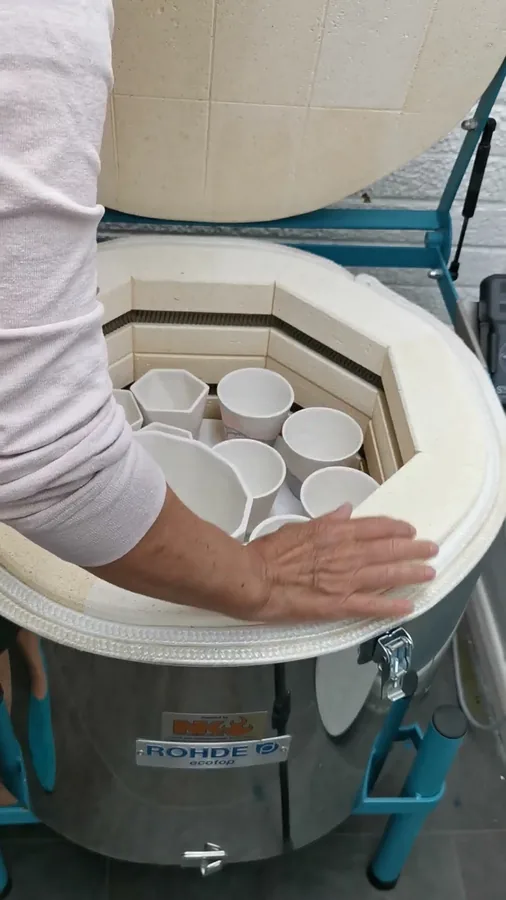 Cups being loaded into the kiln
